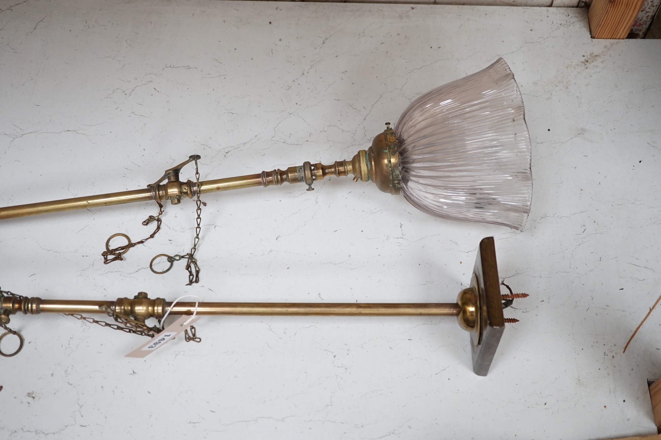 A pair of Victorian brass gas lights, converted to electric